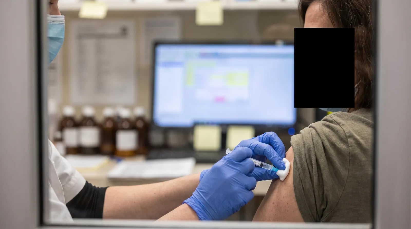 Independent pharmacist reviewing revenue growth strategies at the pharmacy counter